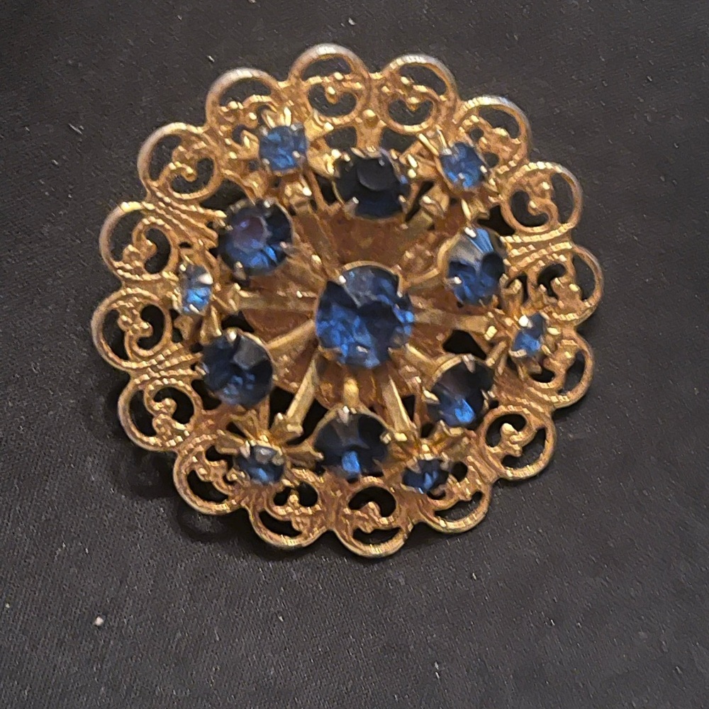 Vintage Gold Tone Circle Brooch with Deep Blue Rhinestones